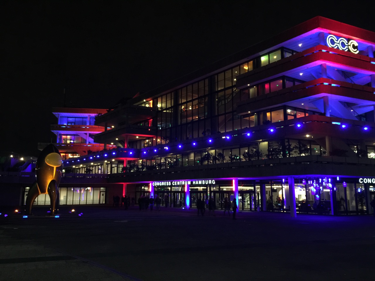 CCH congress center lit up in colorful lights sporting the CCC logo top right