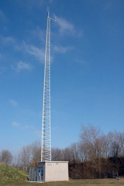 TETRA Transceiver station, a tiny concrete shack with a huge antanna on top.