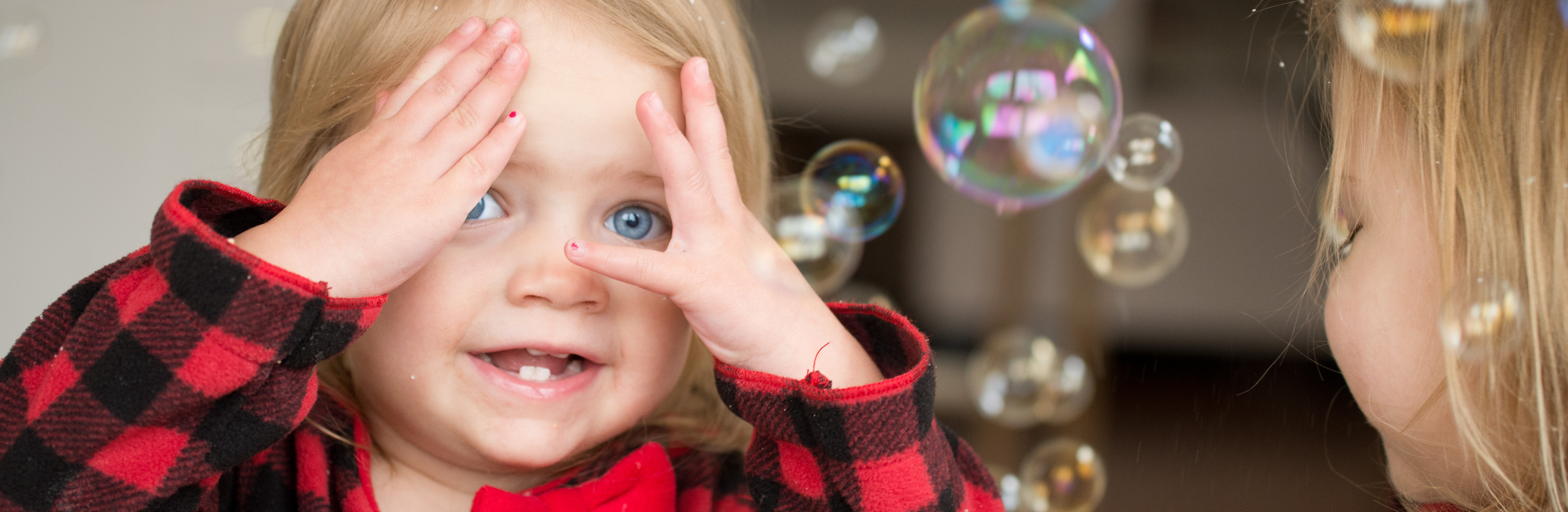 A child playing peekaboo. CC BY 2.0, created by https://www.flickr.com/photos/donnieray/16493237697